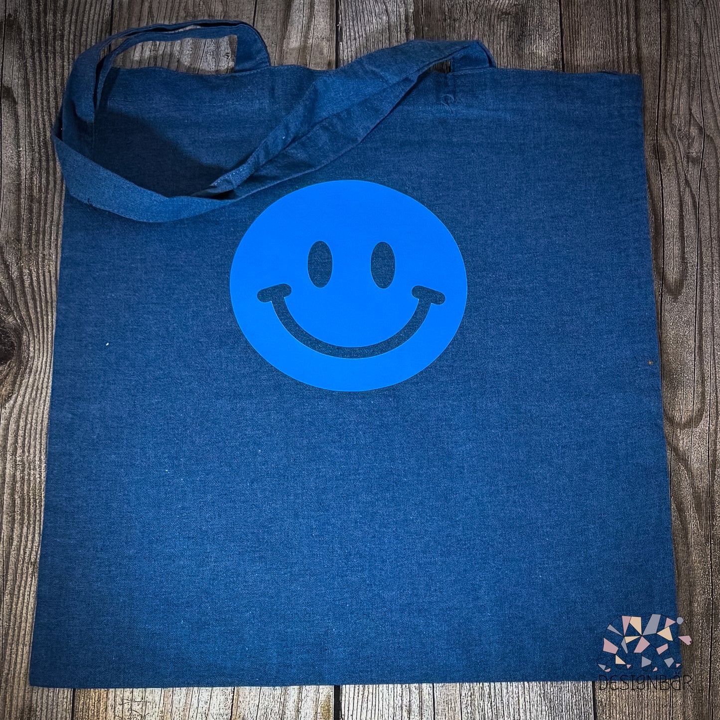 Blauer Jutebeutel mit Smiley-Aufdruck von Designbär