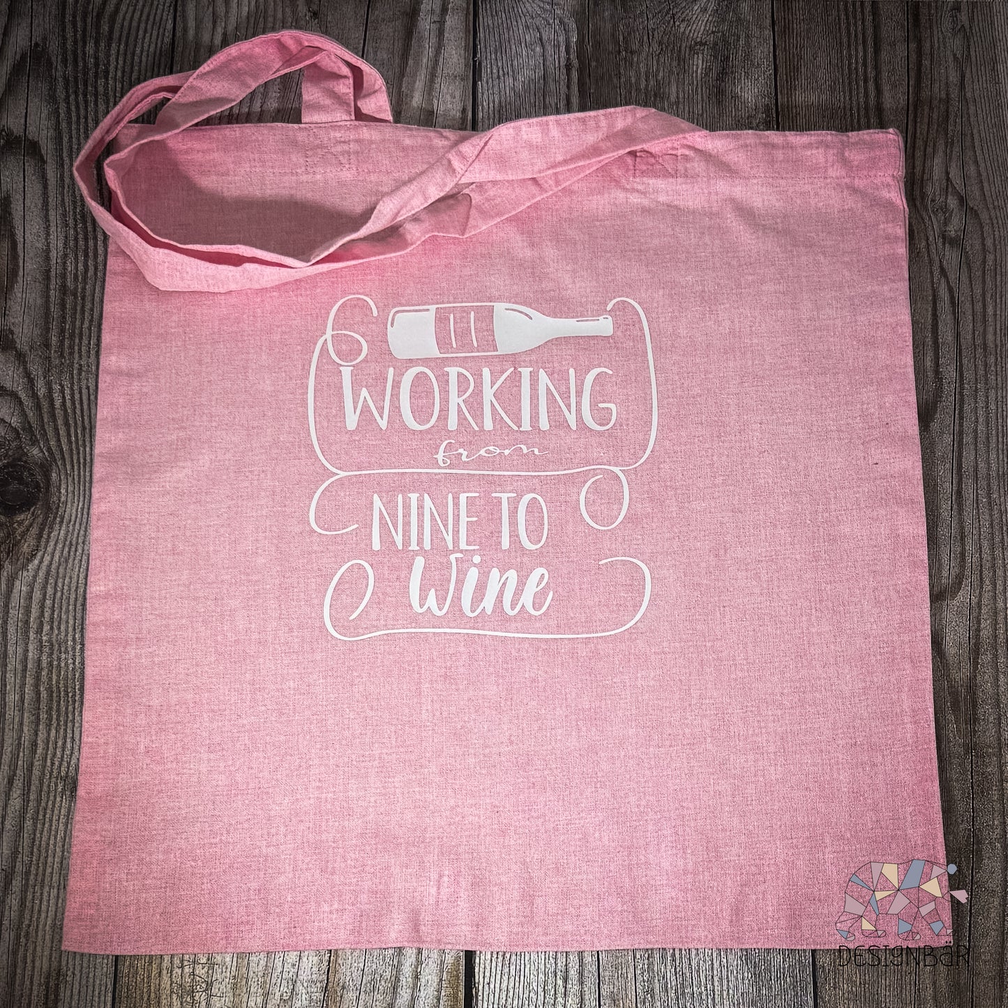 Rosa Jutebeutel mit Aufdruck „Working from…" von Designbär