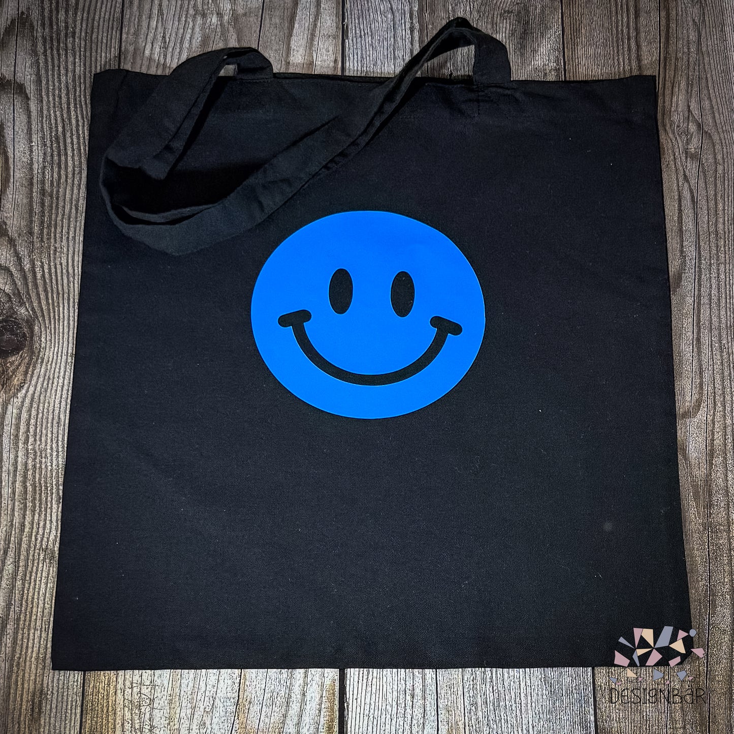 Schwarzer Jutebeutel mit blauem Smiley-Aufdruck von Designbär