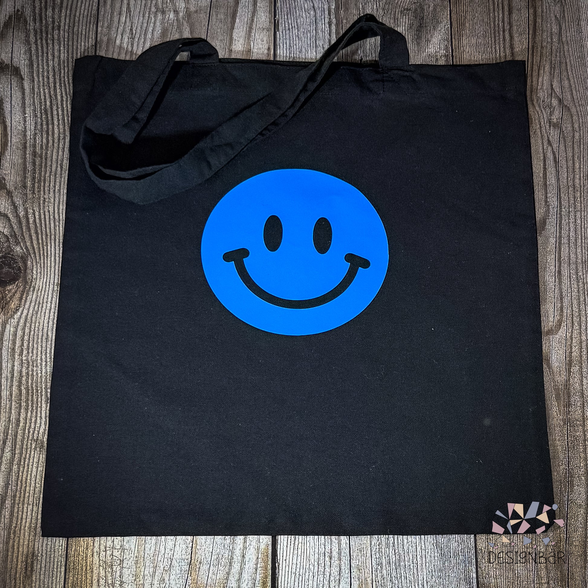 Schwarzer Jutebeutel mit blauem Smiley-Aufdruck von Designbär