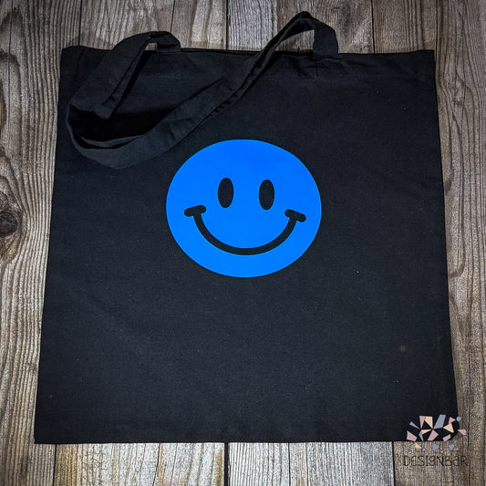 Schwarzer Jutebeutel mit blauem Smiley-Aufdruck von Designbär
